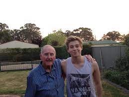 Luke Hemmings with his father