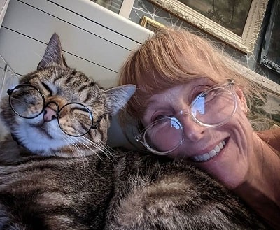 Karen Laine playing with her cat