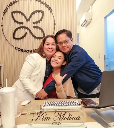 Kim Molina with mother Myra and father Ronnie Molina