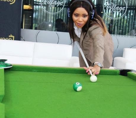 Norma Mngoma playing pool