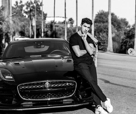 Trevor Tordjman with his love with Jaguar cars