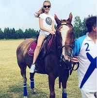 Zhenya Kotova loves horse riding